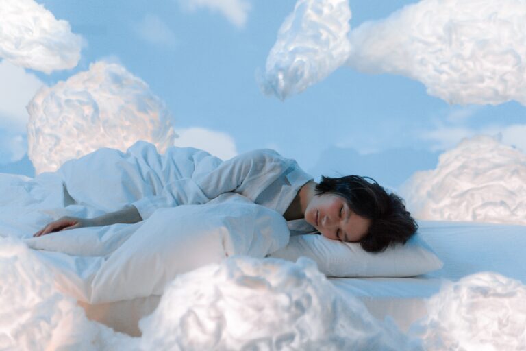 woman napping on a bed of clouds